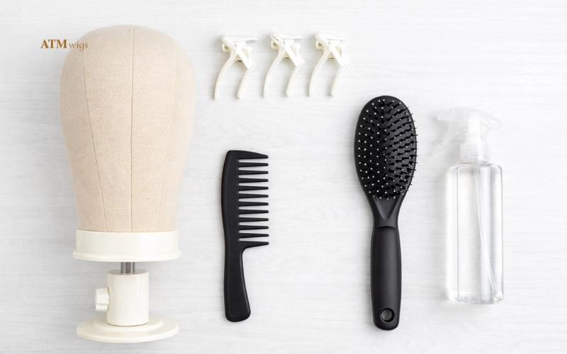 Tools to detangle a synthetic wig: wig stand, clips, wide-tooth comb, loop brush, detangling spray Tools to detangle a synthetic wig: wig stand, clips, wide-tooth comb, loop brush, detangling spray